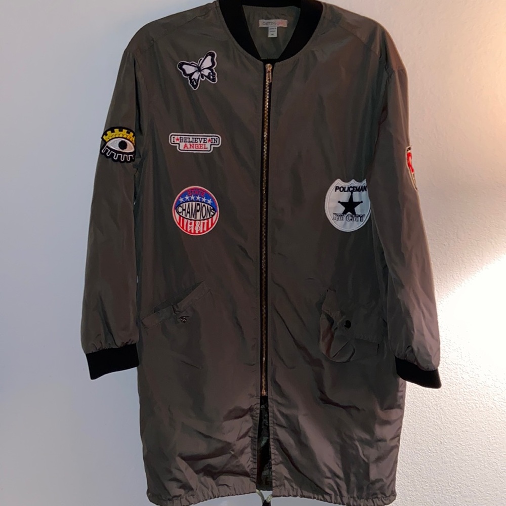 Long green patch windbreaker